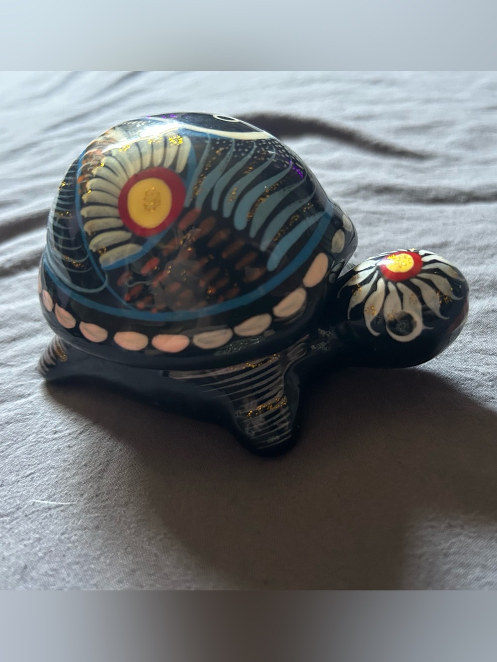 Hand-Painted Black Ceramic Turtle Figurine with Blue and White Accents
